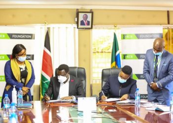 KCB Foundation- Head & Ag. Chief of Party, Caroline Wanjeri Kihara (second right), with the Governor- Tharaka Nithi County, H.E Muthomi Njuki (second left), during the signing of an MOU. Also present is, KCB Branch Manager- Chuka, Stephen Muema and Tharaka Nithi County CEC- Member Youth, Sports & Education, Sheila Kiganka.