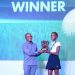Safaricom PLC CEO, Peter Ndegwa, awards the Overall Girl, Audrey Gachora (77
pts). [Photo/ Courtesy]