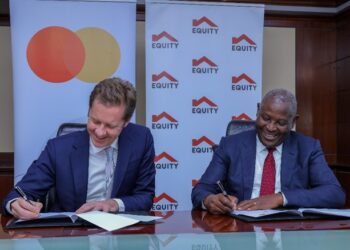 Mark Elliott, Division President for Sub Saharan Africa at Mastercard and Dr. James Mwangi, Equity Group Managing Director and CEO  sign a 10-year partnership agreement that will deliver innovative solutions for various customer segments including e-commerce payments, cross border payments, community pass for farmers and small businesses, QR and tap on phone.[Photo/Courtesy]